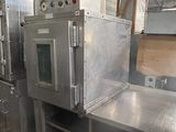 many stainless steel ovens in a large industrial kitchen
