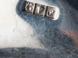 a close up of a silver plate with numbers on it