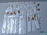 a lot of gold and silver necklaces on a table