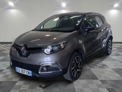 a picture of a grey car parked in a garage