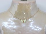 yellow gold butterfly necklace on mannequin with white background