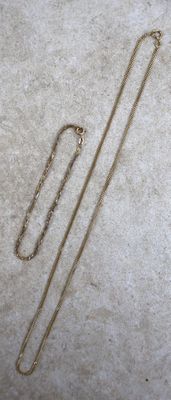 gold filled necklace with a chain on a white background