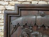a wooden carving of a horse and a bird on a wall