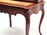 a wooden desk with a drawer on top of it