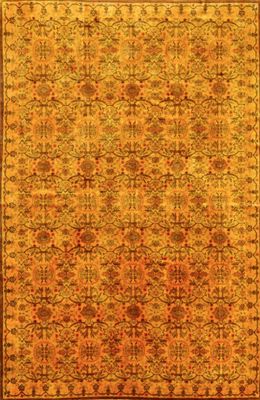 an orange and yellow rug with a floral design on it