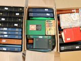 a lot of books in a box on the floor