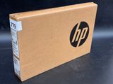 a close up of a cardboard box with a hp logo on it