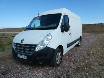a picture of a white van parked on a gravel road