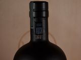 a bottle of wine that is sitting on a table