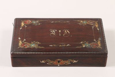 an old wooden box with a decorative design on the lid