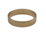 a close up of a gold wedding ring on a white background