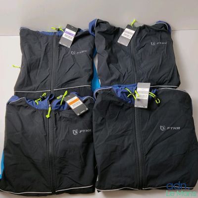 four pieces of luggage bags are lined up on a table