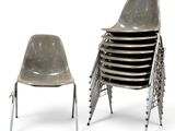 a lot of chairs sitting next to each other on a white surface