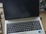 two laptops that are sitting on a desk