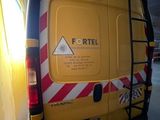 a yellow van that is parked in a garage