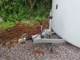 a trailer with a trailer hitching device attached to it
