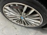 a close up of a tire on a car with a sticker on it