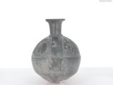 a gray vase that is sitting on a table