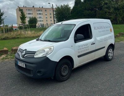 a white van that is parked on the side of the road