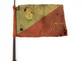 an old red and green flag with the number nine on it