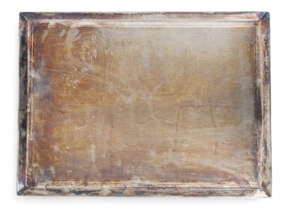 an old metal tray with a rusted surface on a white background