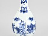 blue and white porcelain vase with figures and flowers on a stand