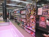 a lot of shelves in a store with various items on them
