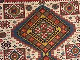 an old rug with many different colors and designs on it