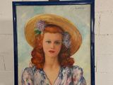 tableau représentant une femme coiffée d'un chapeau, posée sur un chevalet devant un mur de briques