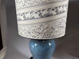 a lamp that is sitting on a table in a room