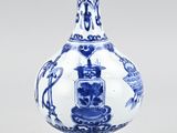 a blue and white vase with an oriental design on it