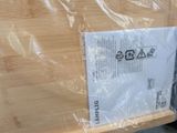a piece of wood that has been wrapped in plastic