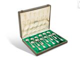 silverware set in a case with green velvet lining