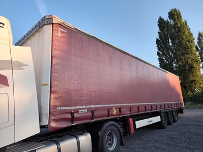 a semi truck that is parked in a parking lot