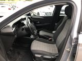 the interior of a car with two seats and a steering wheel