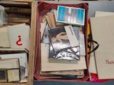 a box full of books and papers sitting on a table