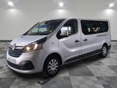 a picture of a silver van parked on a checkered floor