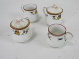 three white coffee mugs sitting on top of a white table