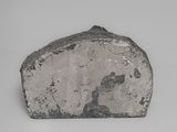 a close up of a rock on a table with a white background