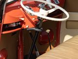 a small car with a steering wheel and a seat in the back