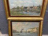two framed paintings of a river scene with buildings and a boat