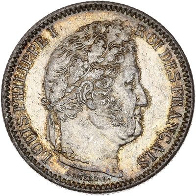 pièce de monnaie en argent portant l'image d'une tête d'homme