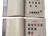 two pages of a book with stamps on them are open