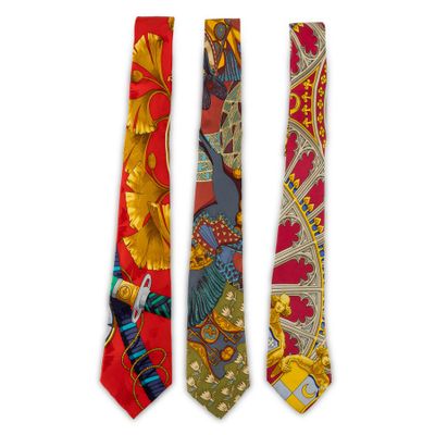 three ties with different designs on them on a white background