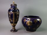 two vases sitting next to each other on a table