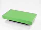 a green box sitting on top of a white surface