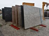 many different types of granites on display in the yard