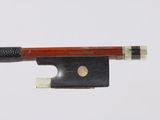 violin bow made of wood and metal with a black handle