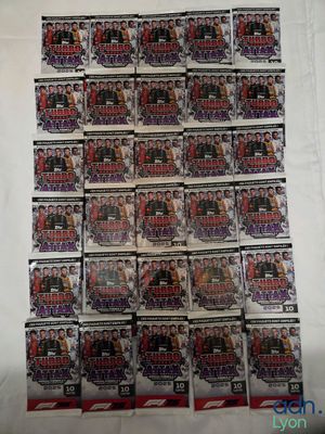 a bunch of baseball cards are stacked on top of each other