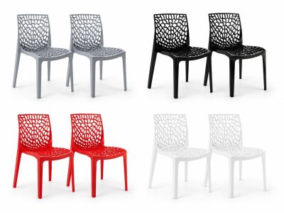 a set of four chairs with different colors of plastic